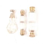 Silver-mounted double-ended scent bottle, another and a white metal mounted scent bottle.