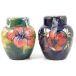 Two Moorcroft pottery ginger jars and covers, 'Hibiscus' and 'Anemone' patterns.