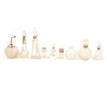 Fifteen silver or white metal-mounted / topped scent bottles, pots and atomisers, and two glass scen