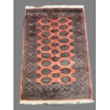 Bokhara rug, salmon pink ground