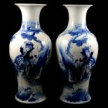 A pair of Chinese blue and white vases, and another similar vase
