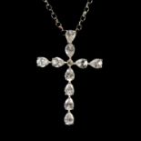 A white gold cubic zirconia cross and chain.