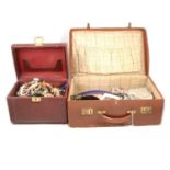 Costume jewellery necklaces, bracelets, old coins, Astor-Safe jewellery box and vintage suitcase.