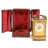 French brass cased carriage clock and travelling case,