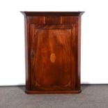 George III inlaid mahogany hanging corner cupboard,