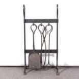 An Arts & Crafts wrought iron fire companion,