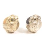 Two silver-plated chick pin cushions.