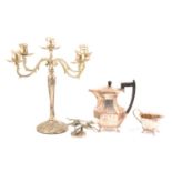 A four piece silver-plated teaset, a pair of candelabra, a greyhound car mascot, plus cutlery.