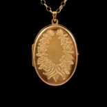 A 9 carat yellow gold photograph locket with chain.