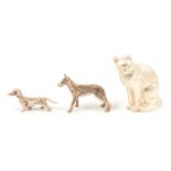 Silver model of a cat, Albert Edward Jones, Birmingham 1974, and small white metal dog models.