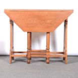 English Arts and Crafts oak octagonal dropleaf table