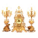 French gilt metal three-piece clock garniture,