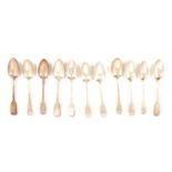 Eleven silver table spoons,