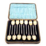 A set of twelve Victorian term head tea spoons, Edward Hutton & Sons