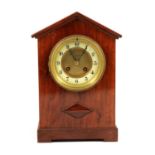 A mahogany cased mantel clock, J A Haskell, Ipswich, ivorine chapter ring, French movement