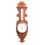 Victorian carved oak aneroid barometer and thermometer,