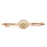 A peridot and seed pearl bar brooch.