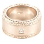 A modern bespoke design diamond set platinum ring.