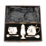 A three-piece silver cruet set, Barker Brothers Silver Ltd, Birmingham 1956.