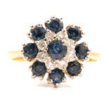 A sapphire and diamond reverse cluster ring.