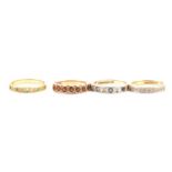 Four gemset half eternity rings.