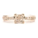 A princess cut diamond ring.