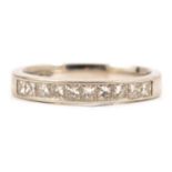 A diamond half eternity ring set with ten princess cut stones.