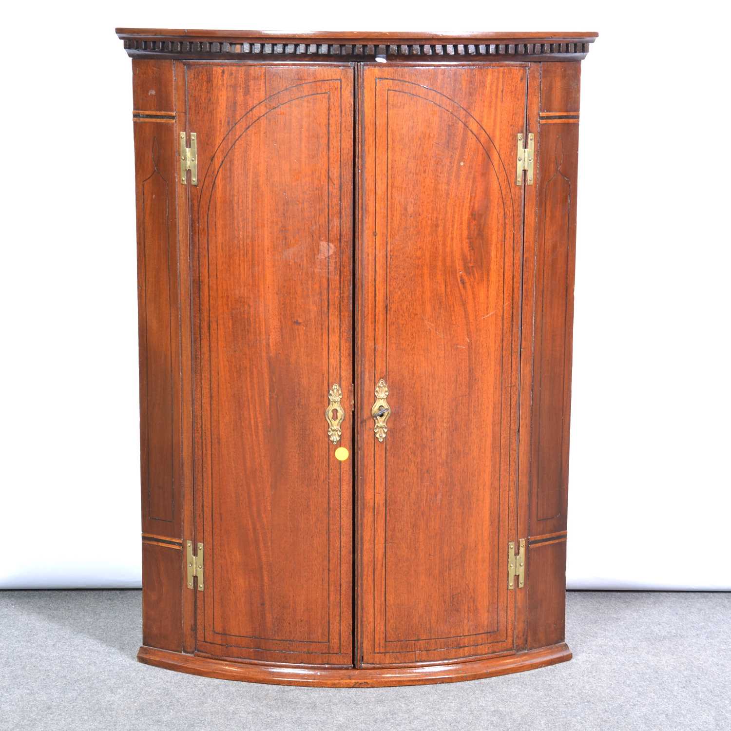 George III mahogany bowfront hanging cupboard,