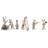 Six-piece cast and patinaed white metal hare band, signed J M Calero