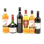 Three bottles of blended whisky, one Couroisier cognac, and two bottles of table wine