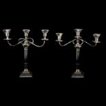 A matched pair of Three-light candleabra, Britton, Gould & Co and William Adams Ltd