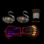 Pair of cut glass and Continental silver swans, set of gilt metal teaspoons, and a carriage clock