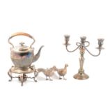 Pair of silver birds, plated kettle on stand, candelabra and three glass decanter.