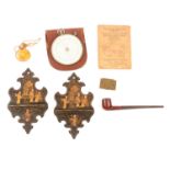 A pair of chinoiserie papier mache wall bracket pipe holders, stamp case, calculator, pipe, perfume