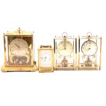 Schatz & Sohne 1000 day torsion clock, carriage clock and two Kundo torsion clocks.