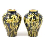 Pair of Doulton Faience vases painted by M Adams, 1876