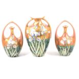 Art Nouveau style garniture of vases, showing the influence of Rozenburg