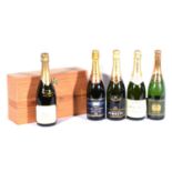 Five bottles of various champagnes, including Drappier Cuvee Du Millenaire 2000