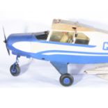 Piper Tripacer flying aircraft model, blue body 'G-ARFB' with LASER glow engine.
