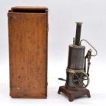 Early 20th century vertical steam engine, height 26cm, with wooden case.