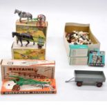 Two Britiains horse carts and furrow, all boxed and a selection of lead animals.