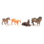 Four Beswick horses.