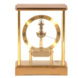 Contemporary brushed gilt metal three glass skeleton clock, Rapport, London