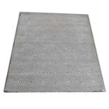 Modern geometric wool rug, retailed by Heals