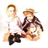 Armand Marseille bisque head doll, 390 head stamp and a EHST doll.