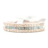 Gemporia - a blue and white diamond half eternity ring.