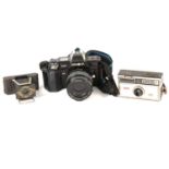 A collection of cameras including Minolta 7000, etc