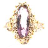 A handmade 18 carat white and yellow gold ring set with amethyst.