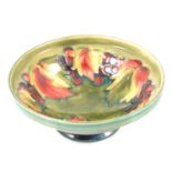 Moorcroft Pottery - 'Leaf and Berry' pattern pedestal bowl.