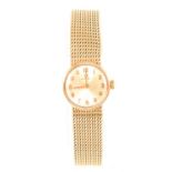 Omega - a lady's 9 carat yellow gold bracelet watch.